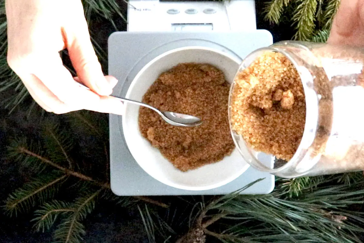 measuring brown sugar for winter sugar scrub