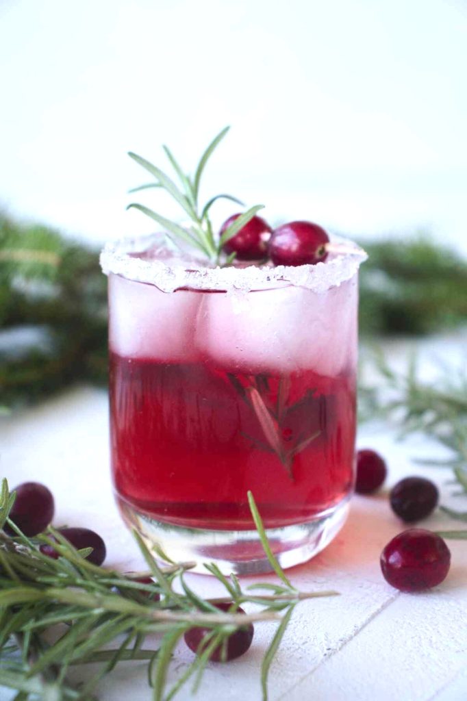 Garnishing Your Festive Cranberry Rosemary Cocktail